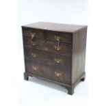 A Georgian mahogany small chest fitted two short & three long graduated drawers with brass swan-neck