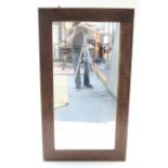 A large pine frame rectangular wall mirror, 64” x 36½”.