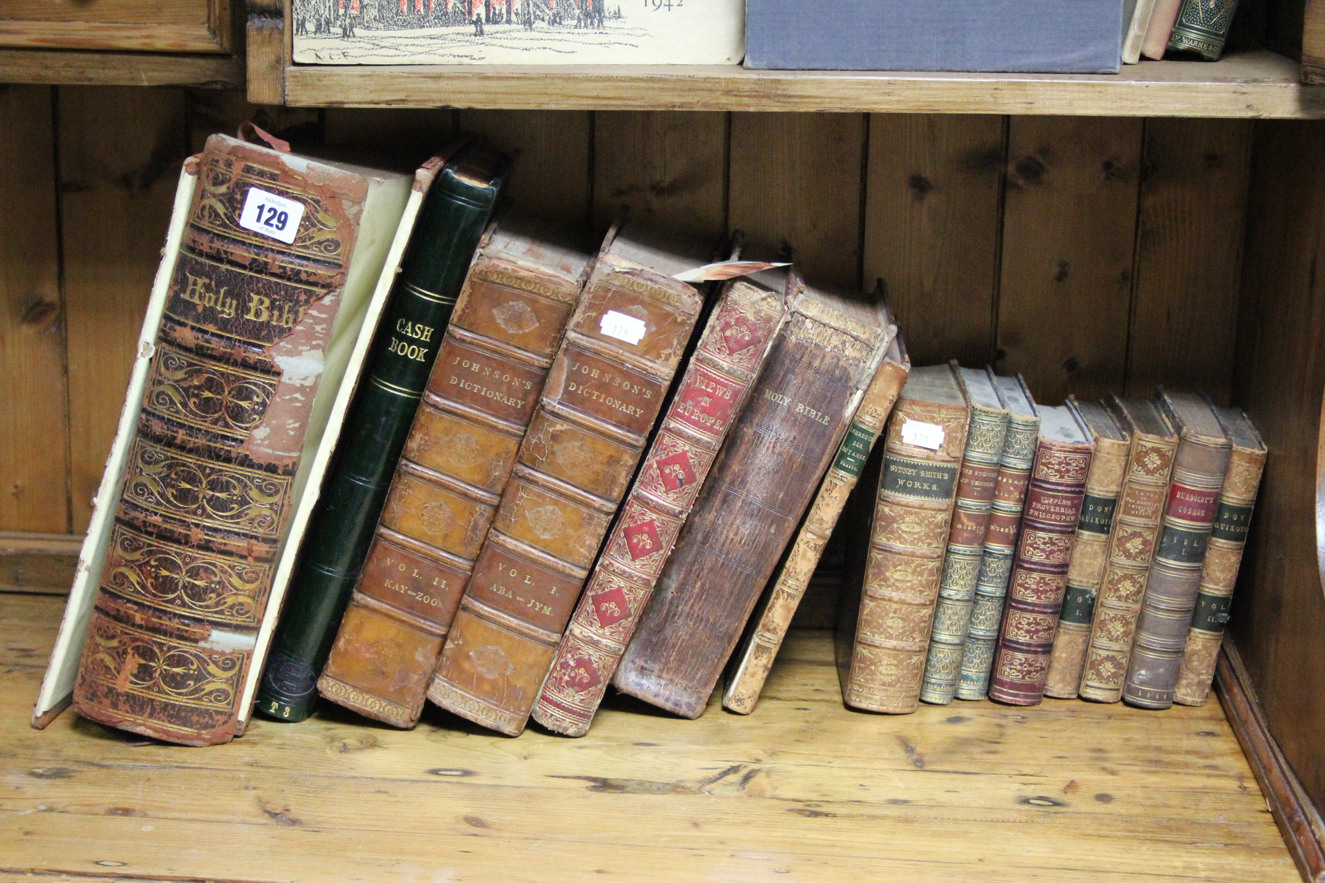 Two leather-bound Holy Bibles; two leather-bound volumes “Johnson’s Dictionary”; a leather-bound