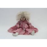 A composition girl doll with blue sleeping eyes & open mouth, 18½" tall, dressed.