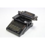 A Smith Premier “No. 10” typewriter with dual keyboard, & with dust cover.