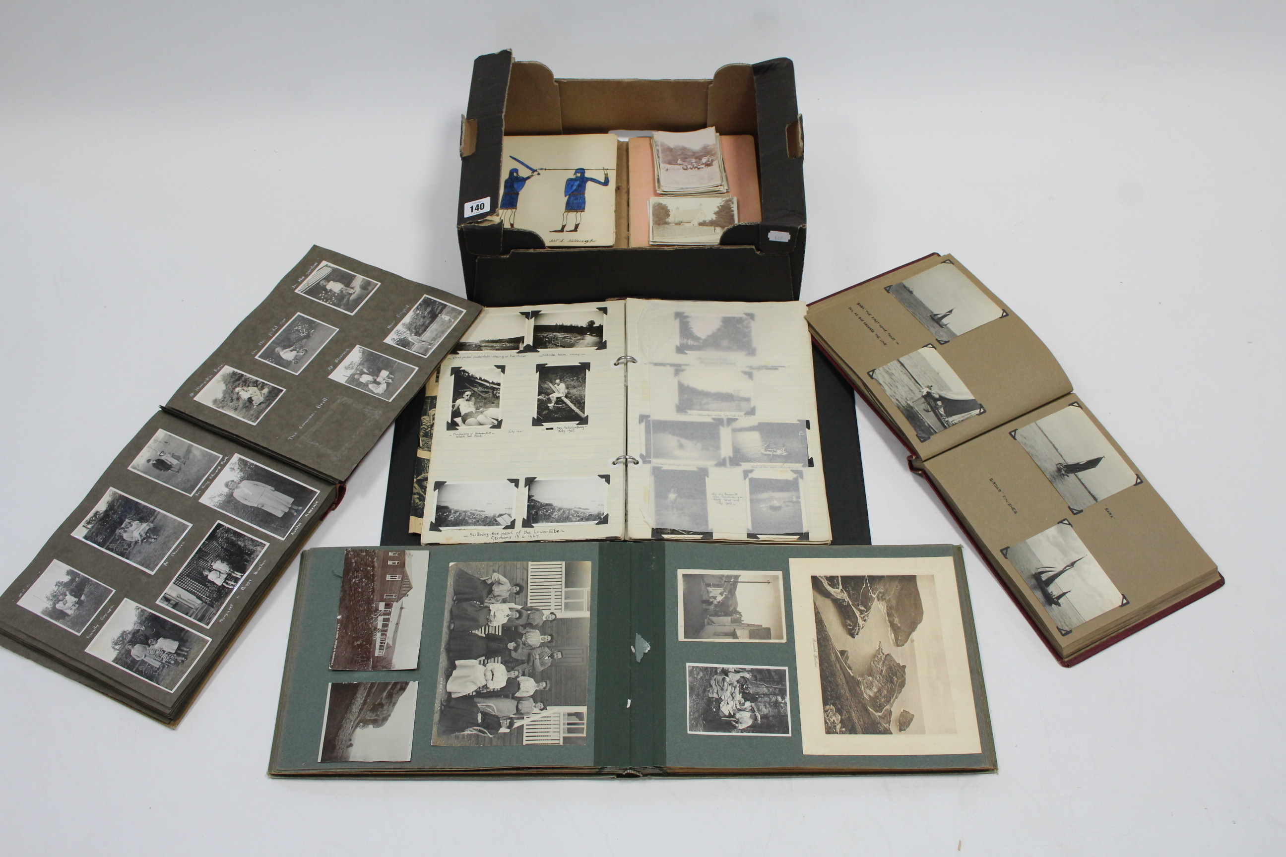 Four family photograph albums, early-mid 20th century including numerous sailing & military