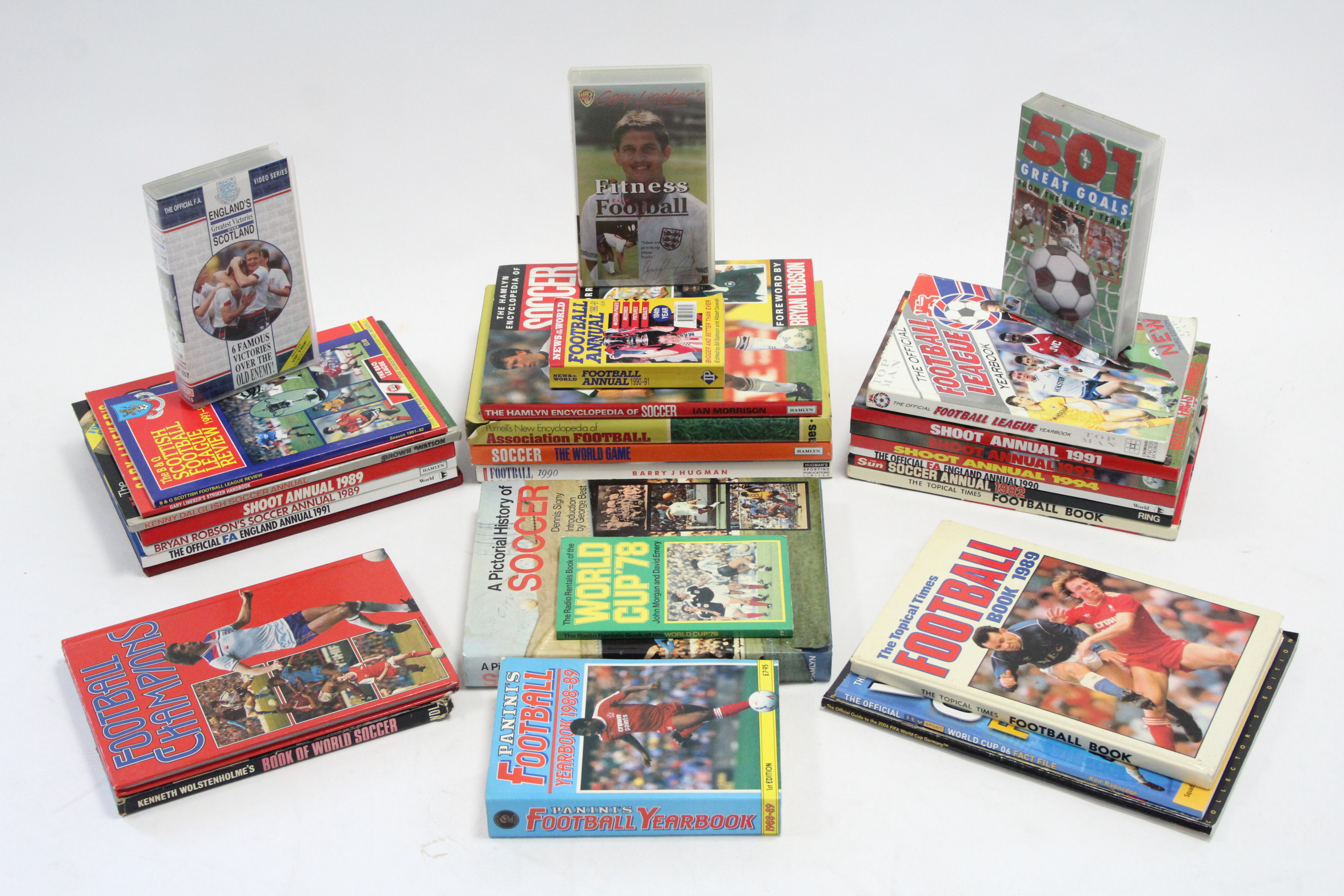 Twenty-five various football-related volumes; and three football video cassettes.