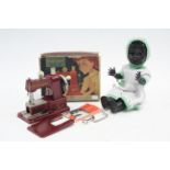 A Vulcan “Senior” child’s sewing machine, boxed; and a Pedigree “16T” black celluloid girl doll.