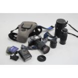 A Minolta “XG-M” camera with four lenses & various other accessories.