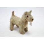 An early/mid-20th century golden plush terrier soft toy, 9½" high (w.a.f.).