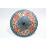 An early 20th century Chinese parasol with painted floral decoration; together with five various