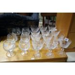 A set of twelve Edinburgh cut-glass wines, 5¼” high; & a set of six cut-glass brandy balloons, 4¾”