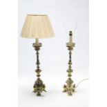 A pair of brass table lamps, each on triform base, one with shade, 22” high.