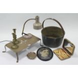 A brass preserve pan with iron overhang handle, 13¾” diam.; a pair of brass candlesticks; a brass