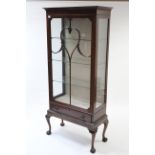 A late 19th/early 20th century mahogany china display cabinet fitted three plate-glass shelves