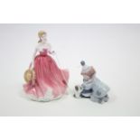 A Lladro Daisa porcelain ornament in the form of a clown with a puppy (No. 5278); & a Royal