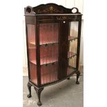 AN EDWARDIAN MAHOGANY SERPENTINE-FRONT TALL CHINA DISPLAY CABINET with simulated inlaid