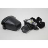 A Minolta “X-300” camera with macro zoom lens & case.