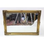 Another large gilt frame rectangular wall mirror with raised scroll border & with beaded edge,
