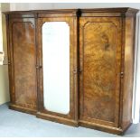 A VICTORIAN BURR-WALNUT VENEERED WARDROBE by GILLOWS of LANCASTER, with moulded cornice, the