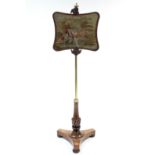 A William IV rosewood & brass pole screen on triform base, the rise-&-fall banner inset wool