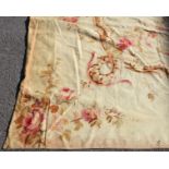 An antique Aubusson large carpet of ivory ground, with oval floral medallion to the centre, floral