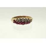 An Edwardian 18ct. gold ring set two rows of five graduated rubies & diamonds, London hallmarks