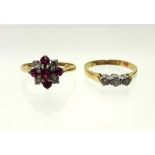 An 18ct. gold ring set cluster of small diamonds & rubies; & a gold ring set three small diamonds (