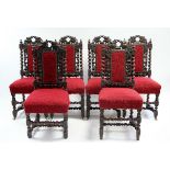 A set of six Victorian walnut Carolean-style dining chairs with carved & pierced padded backs with