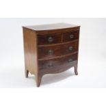 A Regency mahogany bow-front chest with wide satinwood crossbanding to the top, fitted two short &