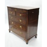 An early 19th century oak chest fitted two short & three long graduated drawers, the top, frieze &