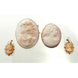 Two oval carved shell cameo brooches, each depicting a classical female bust & in 9ct. gold mount; &