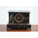 A Victorian striking mantel clock in rouge marble & black slate case; 12" wide x 9" high.