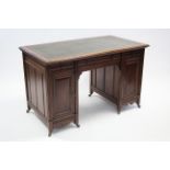 A Gillow & Co. mahogany pedestal desk, with gilt-tooled green leather top, fitted three frieze
