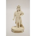 A 19th century Anglo-Indian carved ivory standing figure of a nobleman wearing a crown & long robes,