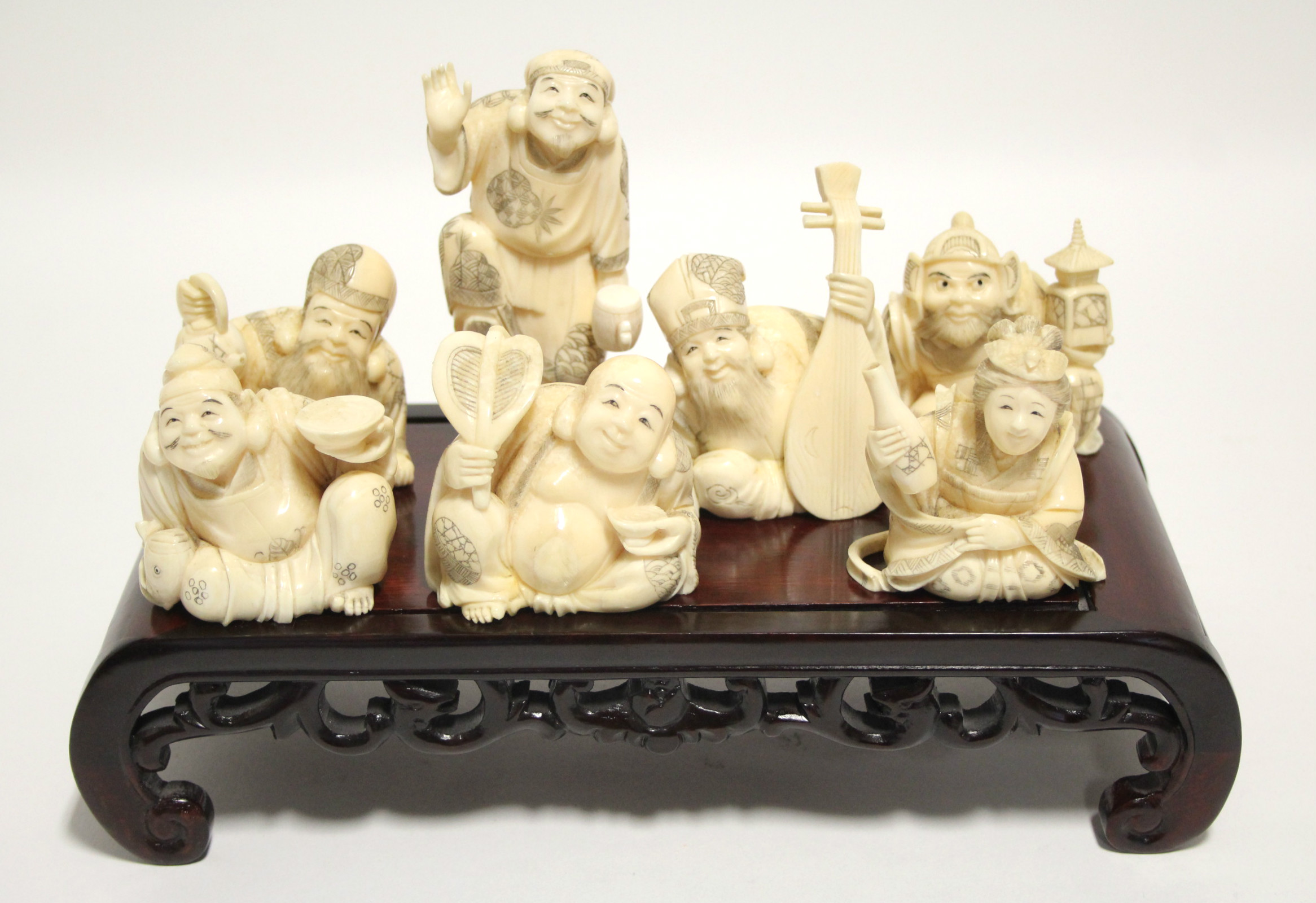 A GROUP OF SEVEN JAPANESE CARVED MARINE IVORY OKIMONO, comprising a standing male figure holding a - Image 2 of 11
