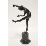 An early 20th century bronze nude figure of a young female dancer balancing balls on her left hand &