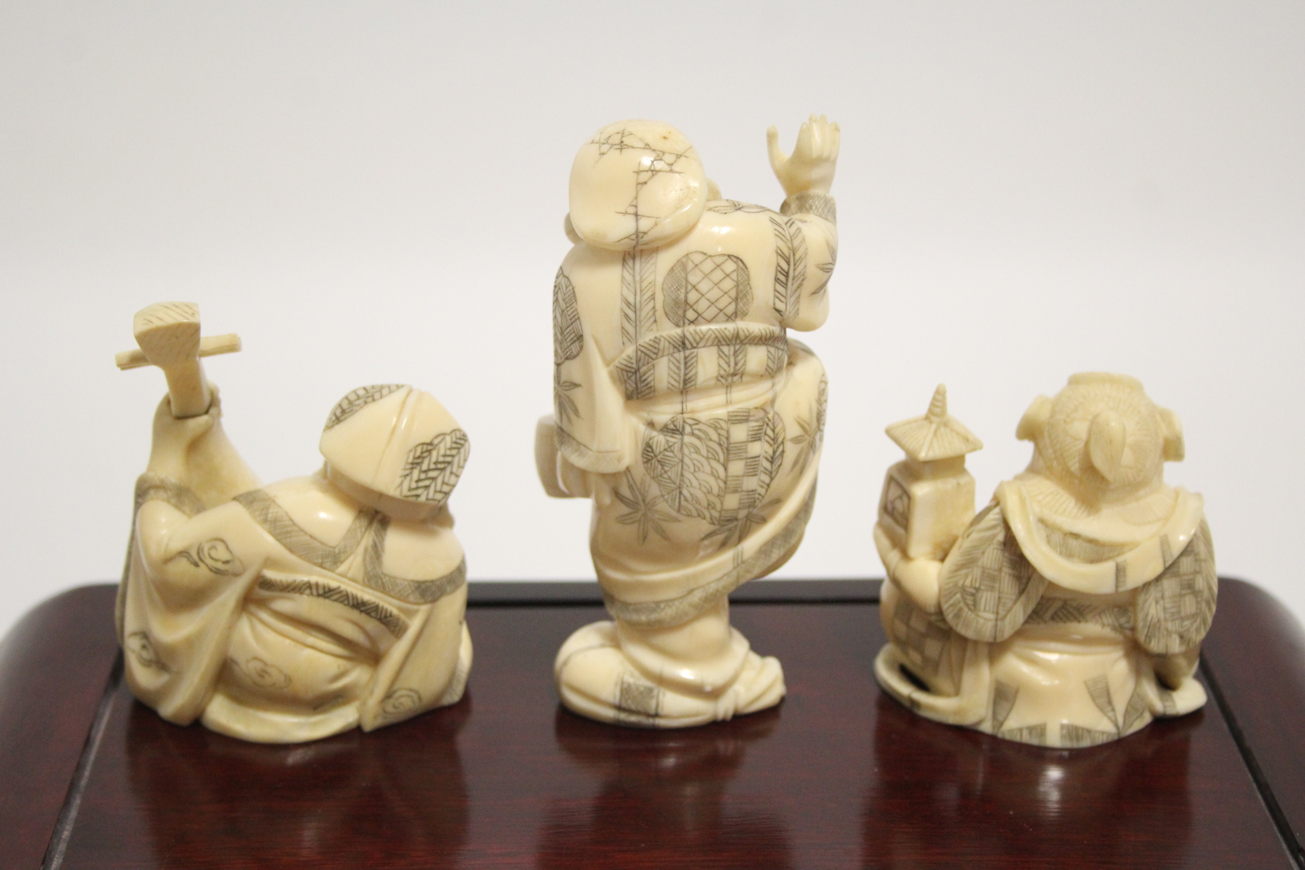 A GROUP OF SEVEN JAPANESE CARVED MARINE IVORY OKIMONO, comprising a standing male figure holding a - Image 4 of 11