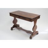 An early Victorian figured mahogany side table fitted two frieze drawers, on shaped flat end