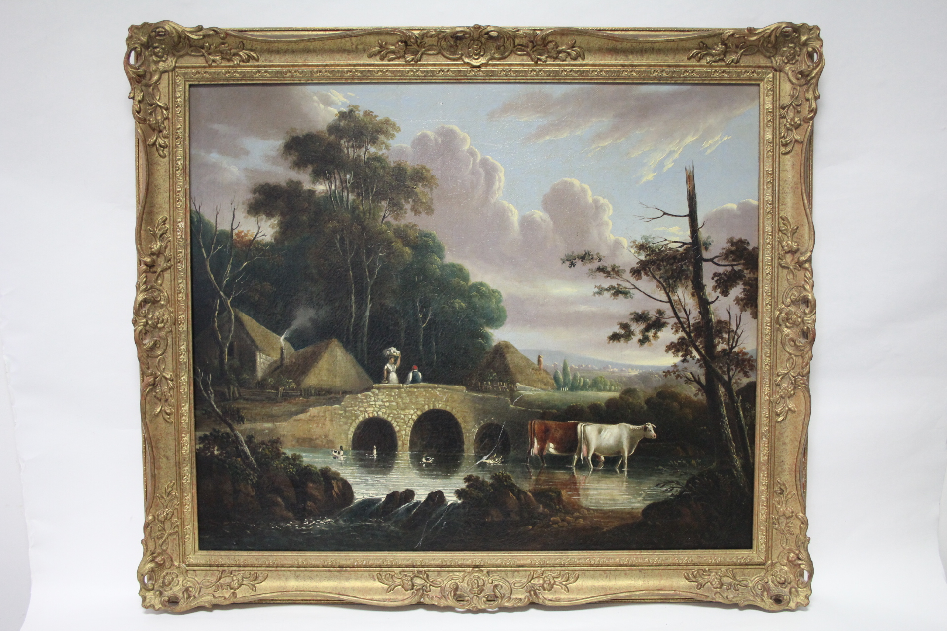 ENGLISH SCHOOL, first half of 19th century. A wooded river landscape with figures on a stone