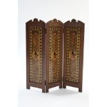 A Victorian oak dwarf three-fold draught screen inset parquetry panels incorporating numerous exotic