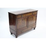 A 19th century mahogany dwarf cabinet fitted long frieze drawer above a pair of panel doors, a