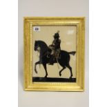 A late 18th century silhouette equestrian portrait of George III reverse-painted on glass bearing