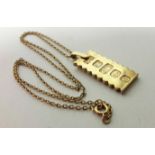 A 9ct. gold ingot pendant with waved edges to two sides; London hallmarks for 1977, (8.3 gm); on