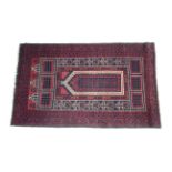 A Baluchi prayer rug of madder ground, ivory & dark blue figured; 54" x 33½".