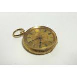 A late 19th century continental ladies' fob watch in 14K engraved case, & with engraved gilt dial.