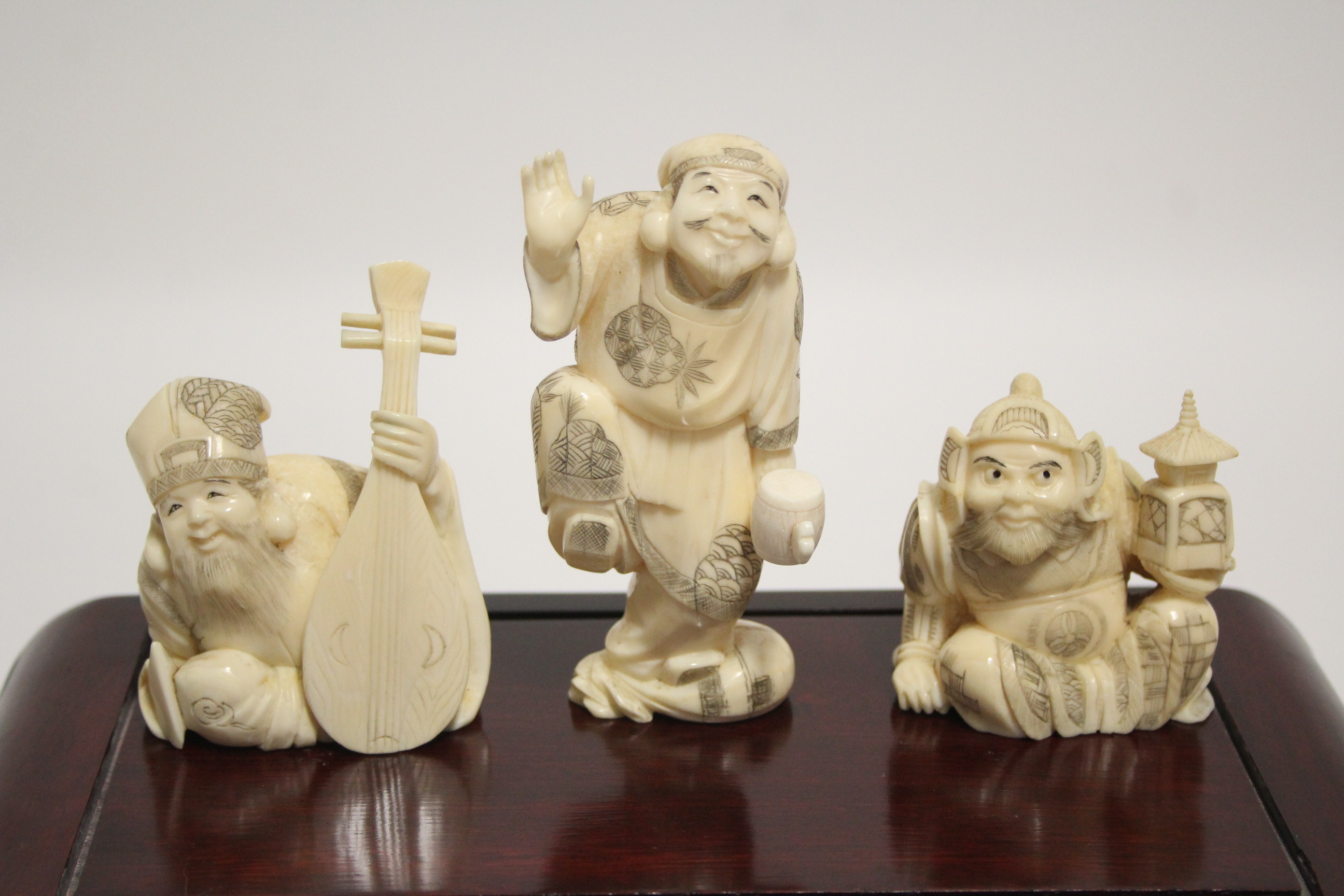 A GROUP OF SEVEN JAPANESE CARVED MARINE IVORY OKIMONO, comprising a standing male figure holding a - Image 3 of 11