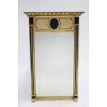 A regency giltwood frame rectangular pier glass with bronzed oval portrait medallion to the frieze &