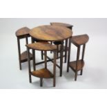 A mid-20th century walnut nest of five occasional tables (four under one).