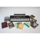 A Yamaha “PSR-32” electric keyboard, w.o.; together with various volumes on music; & a small