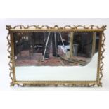 A large gilt frame rectangular wall mirror with pierced border, 31½” x 47½”.