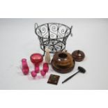 A wrought-metal two-handled circular log basket, 16½” diam.; a cranberry glass bowl; an onyx vase; &