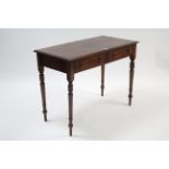 A Victorian mahogany side table fitted two frieze drawers with brass knob handles, & on turned