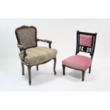 A continental-style elbow chair inset woven-cane panel to back, with loose cushion to seat & on